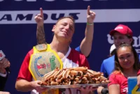 Joey Chestnut Wins 18th Nathan’s Title [titlebase] in Thrilling Hot Dog Eating Contest
