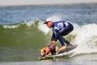 Dogs ride waves for top prize [titlebase] in Annual World Dog Surfing Championships